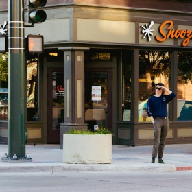 a person standing on the sidewalk