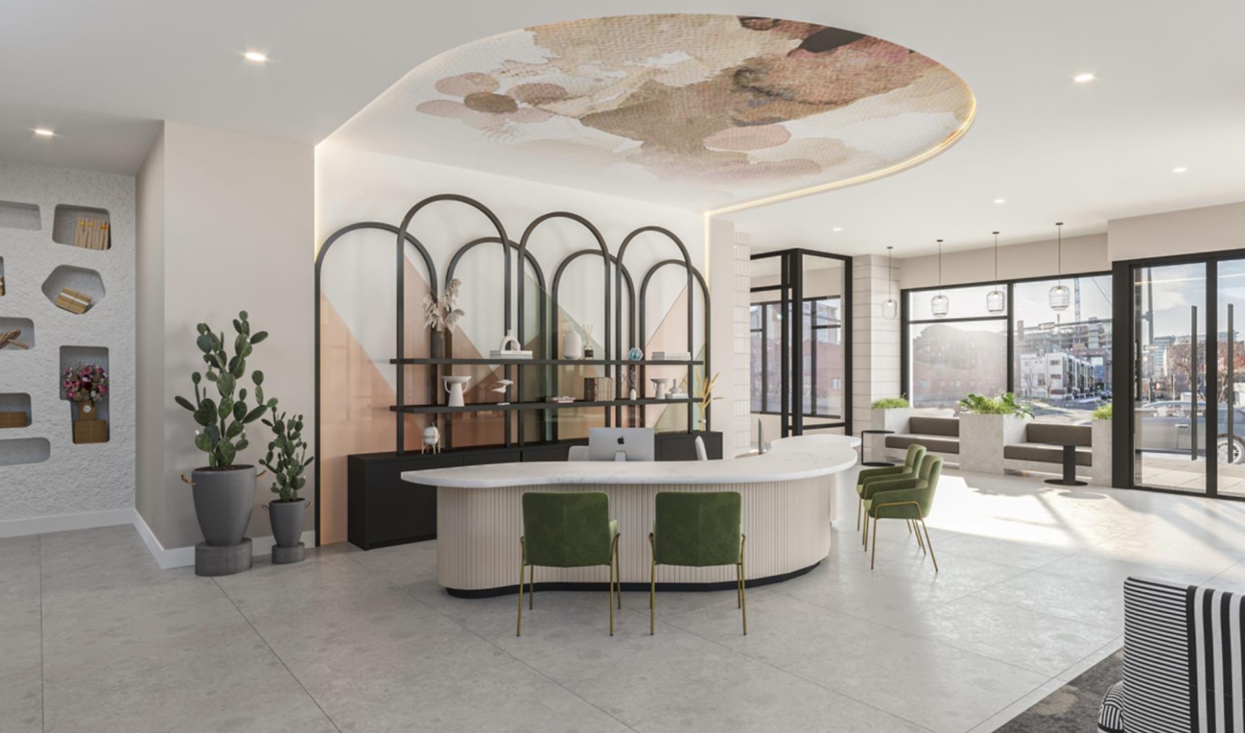 a community lounge with desk area and chairs